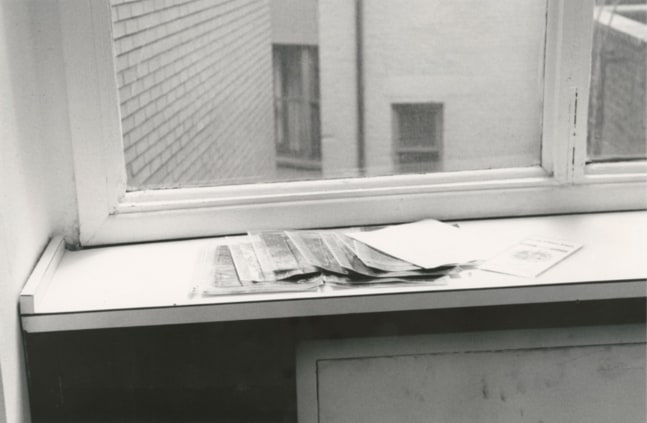 Douglas Huebler Site Sculpture Project #5, 1968, 50 Mile Piece, 1968, Haverhill – Windham – New York City, thirteen gelatin silver prints, written statement. Installation view taken from the exhibition January 5th - 31st, 1969, organized by Seth Siegelaub, at his gallery at 44 East 52nd Street, New York, 1969. The statement, with thirteen photographs, constitutes the piece and reads:  "This work is formed by thirteen photographs that serve to mark the location of sites listed above (and marked in that sequence) which actually describe 50 mile intervals of highway space. All photographs were taken fifteen paces from the edge of the road with the camera ahead about three feet above the site and at a right angle to it."