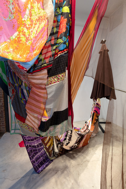 Eric N. Mack Landlord (detail), 2021 umbrella, wood flagpoles, metal brackets, fabric collage, thread dimensions variable
