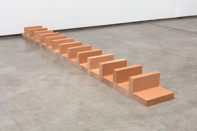Carl Andre
Douglas Fir Rank, Los Angeles, 2009
Douglas Fir
27 units on floor; 14 horizontals, on face, spaced by 13 verticals, on edge, extending from base of wall
each: 1 3/4 x 9 1/2 x 5 3/4 in. (4.4 x 24.1 x 14.6 cm)
overall: 5 3/4 x 9 1/2 x 103 1/2 in. (14.6 x 24.1 x 262.9 cm)

&amp;nbsp;