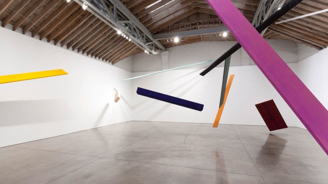 Joel Shapiro Untitled, 2012-2014 wood, casein, and cord 10 pieces: A: 1 9/16 x 10 x 170 in. (4.0 x 25.4 x 431.8 cm) (orange/brown) B: 1 3/16 x 13 1/2 x 142 1/2 in. (3.0 x 34.3 x 362.0 cm) (green/grey) C: 10 1/2 x 16 x 131 in. (26.7 x 40.6 x 332.7) (paris blue) D: 8 x 17 1/2 x 80 in. (20.3 x 44.5 x 203.2 cm) (pink) E: 1 5/16 x 20 x 174 in. (3.3 x 50.8 x 442.0 cm) (yellow) F: 1 3/4 x 6 x 211 7/8 in. (4.4 x 15.2 x 538.2 cm) (lamp black) G: 1 27/32 x 13 x 151 in. (4.7 x 33.0 x 383.5 cm) (cobalt violet) H: 2 x 4 x 320 in. (5.0 X 10.2 X 812.8) (malachite) I: 1 11/16 x 3 x 240 in. (4.3 X 7.6 X 609.6 cm) (white) Door: 1 1/8 x 39 7/8 x 86 in. (2.9 x 101.3 x 218.4 cm) (urbino red) installation dimensions variable