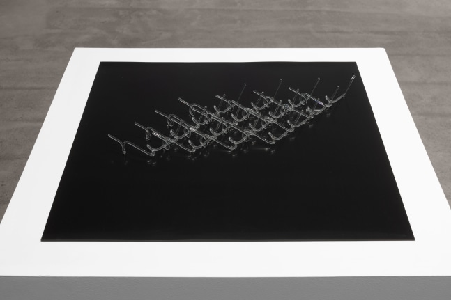 Tauba Auerbach, Helical Maille (Z), 2022, borosilicate glass and rubber, 23 3/4 x 23 3/4 x 2 in. (60.3 x 60.3 x 5.1 cm)