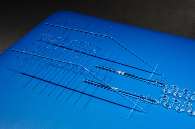 Tauba Auerbach Where there had once been a snag in the fabric, 2018 Borosilicate glass on cushioned physical therapy table sculpture: 6 3/4 x 18  x 66 1/2 in. (17.1 x 45.7 x 168.9 cm) base: 86 x 33 1/4 x 48 in. (218.4 x 84.5 x 121.9 cm)