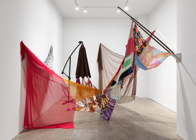 Eric N. Mack, Landlord (detail), 2021, umbrella, wood flagpoles, metal brackets, fabric collage, thread dimensions variable