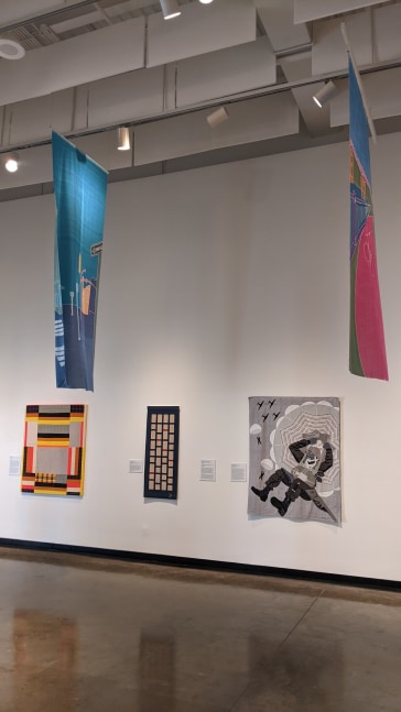 Installation View, Columbus Museum, A Ribbon Runs Through It: Textiles from The Columbus Musem, Columbus, GA. January 17 - March 04, 2023.&amp;nbsp;

Left to right: Paolo Arao, Rebecca Bluestone, Dawn Williams Boyd. Hanging: Ren&amp;eacute; Shoemaker.
