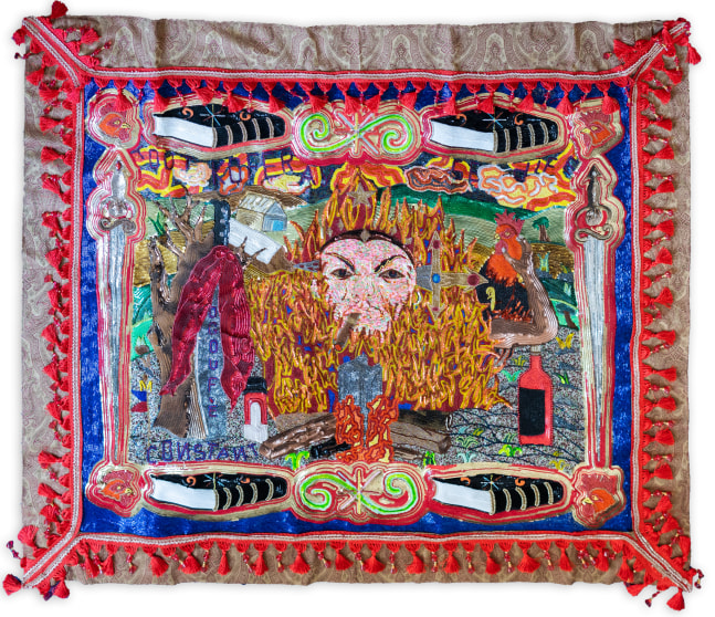 A textile piece of a floating head smoking a cigar surrounded by other objects