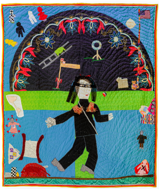 A quilt depicting Michael Jackson surrounded by various objects