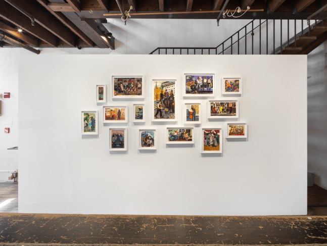 An image of a wall with multiple small prints in frames