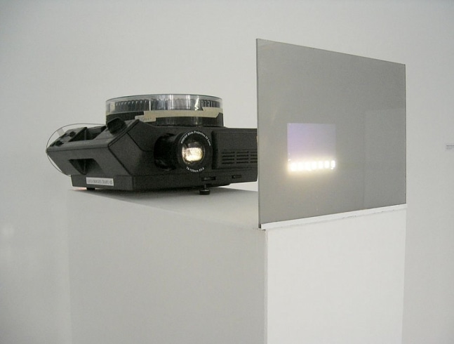 Anthony McCall, Miniature in Black and White, 1972

81 slides, Plexi, &amp;amp; projector, 11x24 3/8x61 3/8 inches