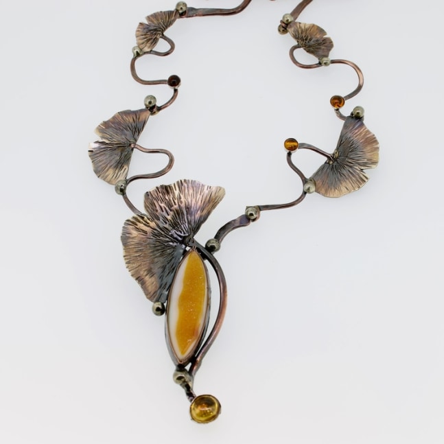 Autumn ginkgo leaves necklace
Necklace constructed, fused, soldered, and chased of copper, bronze, and silver. It highlights a natural orange Drusy cabochon from Indonesia, Baltic Amber, and citrine.
2.5&amp;quot; x 11&amp;quot; x .5&amp;quot;
2017