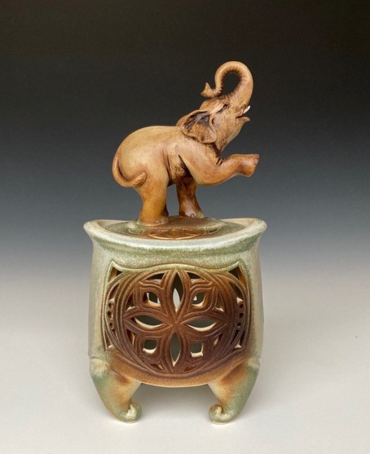 Asian Elephant Censer
Porcelain and White Stoneware
6&amp;quot; x 10.5&amp;quot; x 3.5&amp;quot;
2020
Wheel thrown porcelain vessel is altered and pierced. The Elephant is sculpted and carved using white stoneware. Glazed with oxides, microcrystalline, and ash glazes, then fired in oxidation to cone 6.&amp;nbsp;