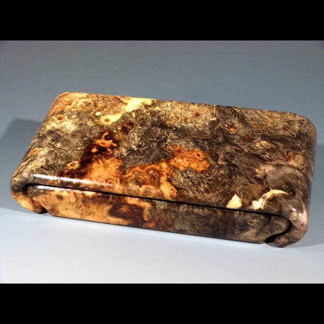 Starry Night Treasure Chest
Buckeye Burl -&amp;nbsp;Sliding lid box sculpted from a solid piece of Buckeye Burl. Rubbed Hand brushed Lacquer Finish. Fully lined. Felt glides for smooth opening action. Felt feet on the bottom.
10&amp;quot; x 2&amp;quot; x 4&amp;quot;
2021