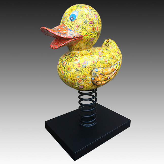 Rubber Ducky
wood, bottle caps resin
17&amp;quot; x 32&amp;quot; x 24&amp;quot;
2017
carved wood covered w/ thousands of flattened bottle caps. the caps range from the 1930&amp;#39;s to current. finished w/ a few thick coats of epoxy resin sealing the sculpture but still leaving texture to touch. the spring &amp;amp; base is steel finished w/ powder coat