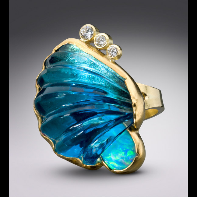 Breaking Wave Ring with Hand Carved Blue Topaz

Hand Carved Gemstones in Gold

1.88&amp;quot; x 1.25&amp;quot; x 1.38&amp;quot;