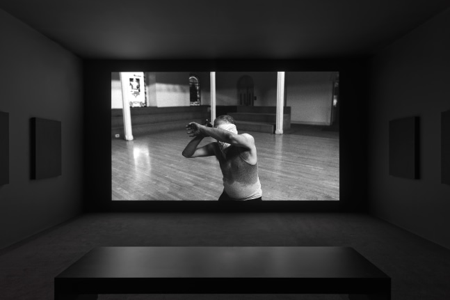 Installation view of film by Adam Pendleton Ishmael in the Garden: A Portrait of Ishmael Houston-Jones 2018 Black-and-white and color video, 24 minutes 15 seconds Dimensions variable