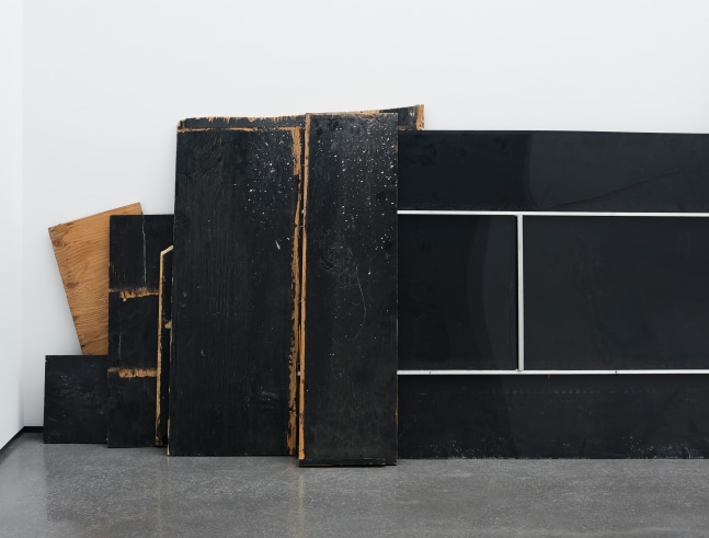 Installation view of sculptures by Peter Fischli and David Weiss and works by Wade Guyton