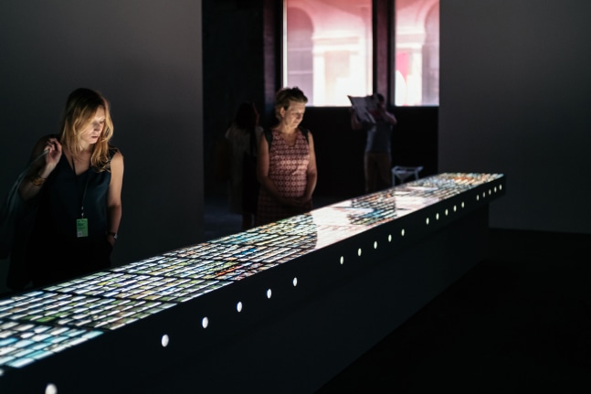 Installation view of images by Peter Fischli David Weiss