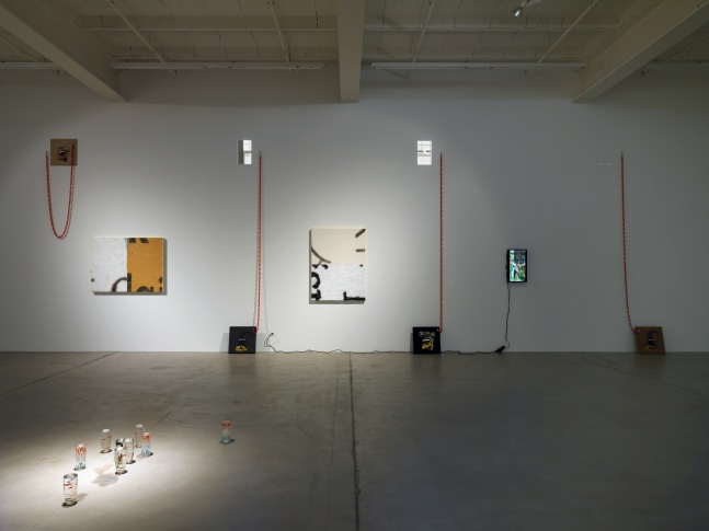 Installation view of Adam Pendleton and Pope.L wall-based works and sculptural installation