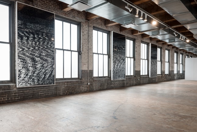 Installation view of paintings by Adam Pendleton