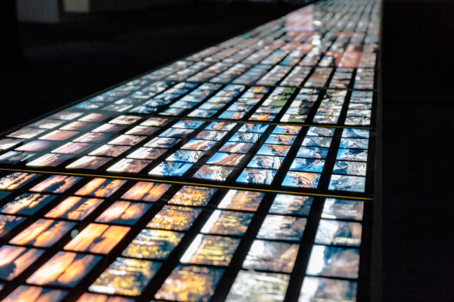 Installation view of images by Peter Fischli David Weiss