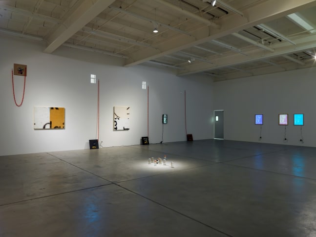 Installation view of Adam Pendleton and Pope.L wall-based works and sculptural installation