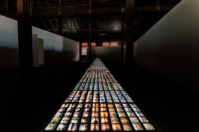 Installation view of images by Peter Fischli David Weiss