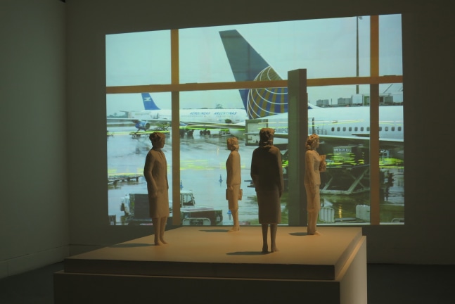 Installation view of video work and sculptures by Peter Fischli and David Weiss