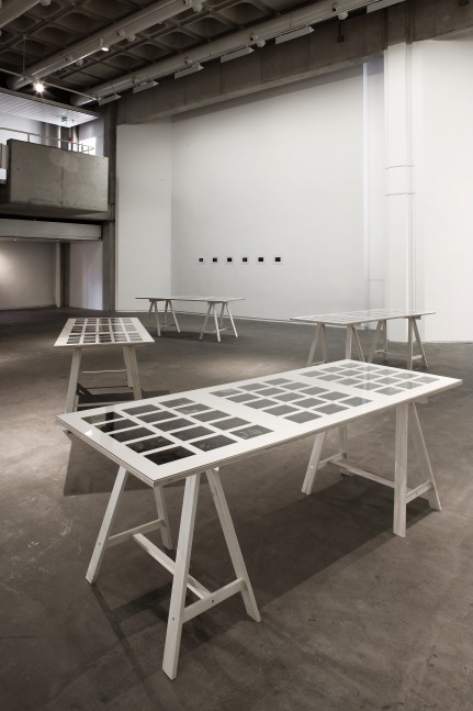 Installation view of photographs by Peter Fischli and David Weiss