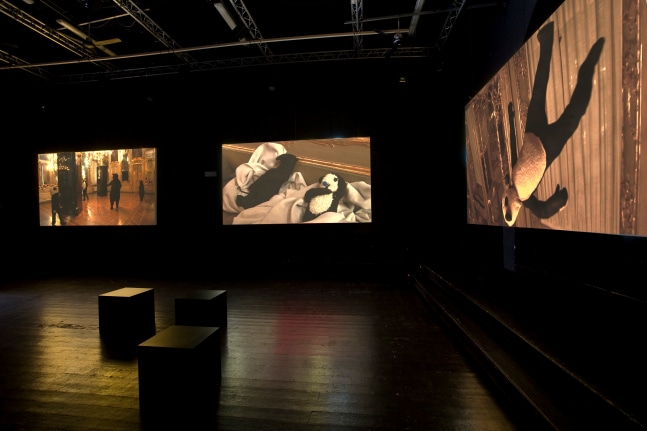 Installation view of video works by Peter Fischli and David Weiss