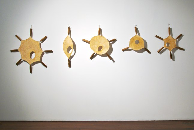 Drumbeats, 2009
Stainless steel, muslin, tamarind kernel, wood, and lacquer
36" x 135" x 4 1/2"