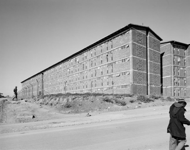 David Goldblatt
South-east wing of a hostel for Black male workers erected during apartheid as part of a scheme to make Joburg city and suburbs white. Alexandra Township. 1 June 1988 (4_5388), 1988
Silver gelatin print on fibre-based paper
Work: 47.5 x 59.5 cm / 18.7 x 23.4 in.
Frame: 81.5 x 69.5 cm / 32.1 x 27.4 in
Edition 4 of 10

Enquire