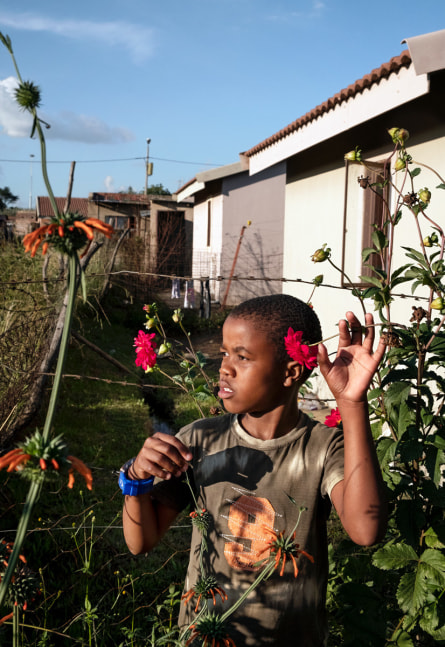 Lindokuhle Sobekwa

Yonelisa Samela in his grandmother&amp;rsquo;s garden during

South Africa&amp;rsquo;s first lockdown, 2020

Inkjet print on cotton rag

Work: 60 x 40 cm (23.6 x 15.7 in.)

Edition of 7 + 2 AP