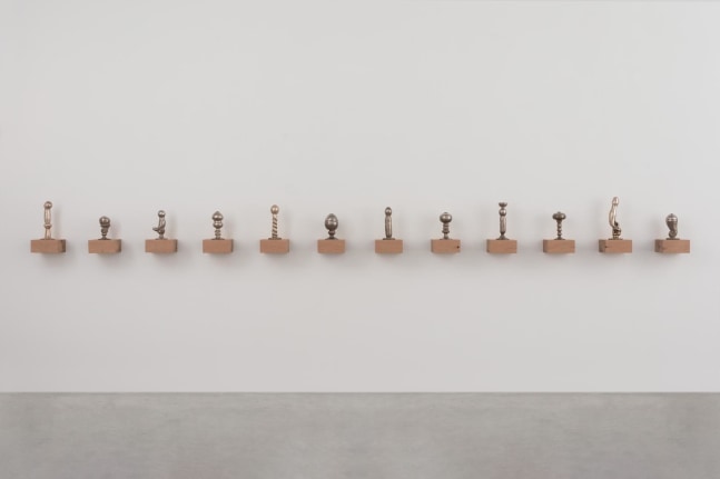Dorothy Cross,&amp;nbsp;The First Supper, 1992, 12 objects, hand-blown glass, liquid silver, each shown on an oak shelf, installation dimensions variable