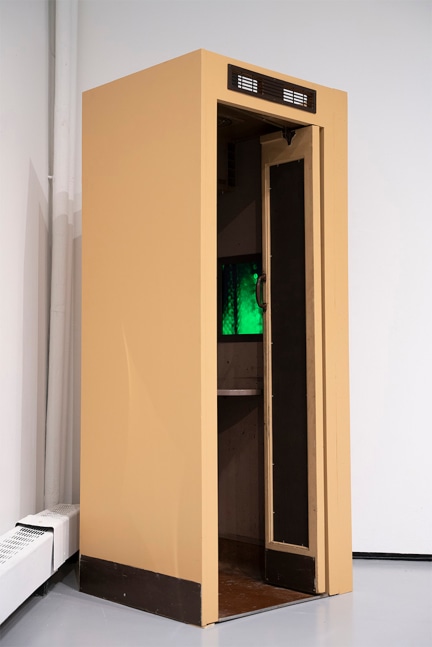 An installation image of the refurbished telephone booth video installation by Mickey Aloisio