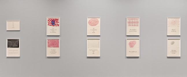 An image of the Louise Bourgeois suite of 9 diptychs with 1 title page, each in a white frame mounted on a grey wall