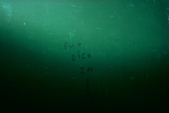 Image of a bathroom stall with text &quot;Put Dick In&quot; and an arrow pointing down by Mickey Aloisio