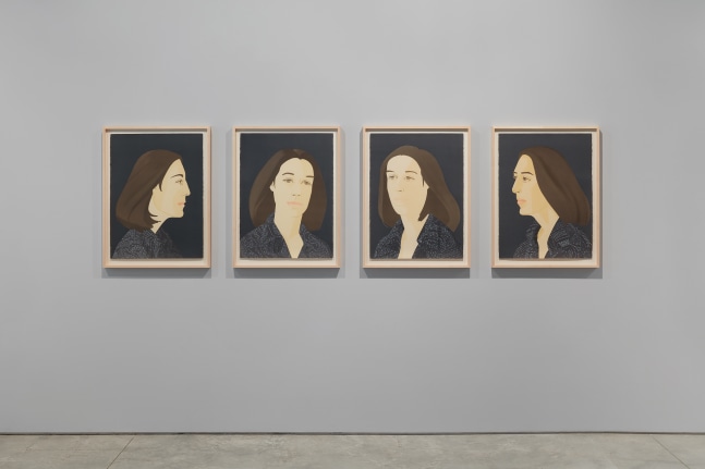 Installation view of four framed portraits by Alex Katz featuring a woman with brown hair and blue shirt against a dark background facing a perspective view in each piece