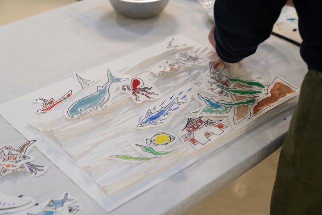 For example, if you see an ocean in the crumpled paper, then create fish and seaweed and stick it on top. I am making that example. The paper may look like mountains, food, Godzilla, flowers, etc. I want students to enjoy their free creative-thinking.