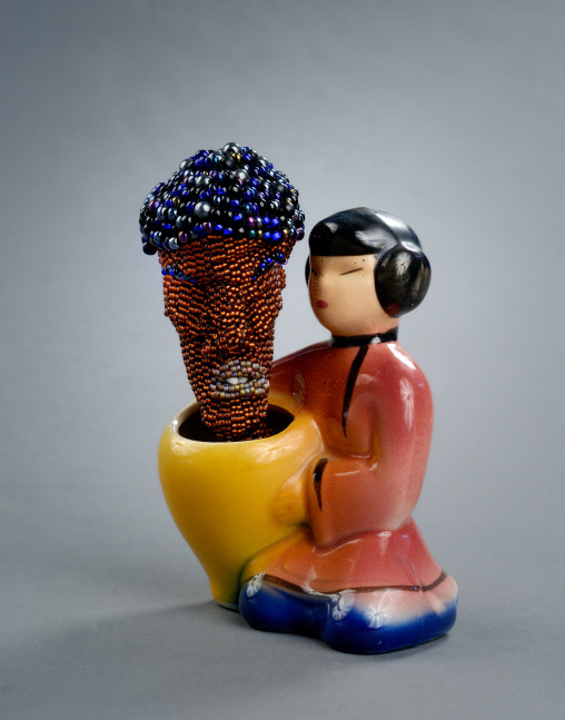 Joyce J. Scott
From the Still Funny Series: Asian/Negro, 2011&amp;nbsp;
Japanese ceramic figurine, beadwork, thread, African carving
6 x 4 x 2 3/4 in. (15.24 x 10.16 x 6.99 cm)
SCO-0381-C