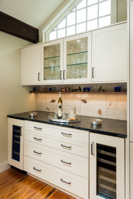 Fossil fish and leaves were used to create this backsplash