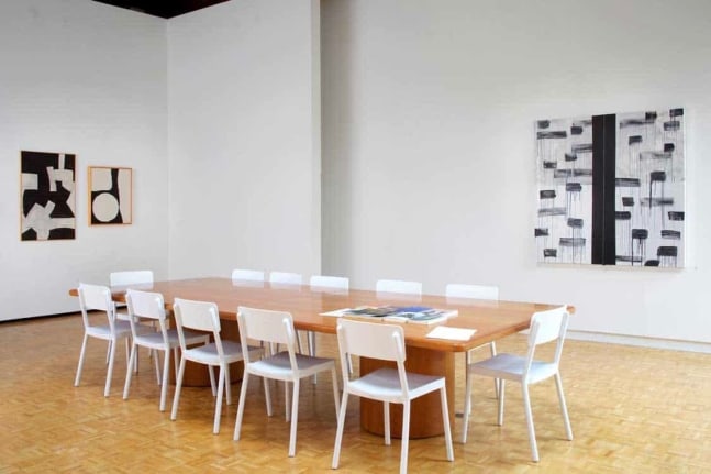 Tony Smith, Untitled, 1962, oil on canvas, 44 x 28 inches, and Untitled, 1959, oil on canvas, 30 x 34 inches, with Torkwase Dyson, Orientation #2, 2018, acrylic, string, and steel on canvas, 5 x 5 feet, in Scaler, Suzanne Lemberg Usdan Gallery, Bennington College, Bennington, Vermont, September 18&amp;ndash;December 15, 2018.