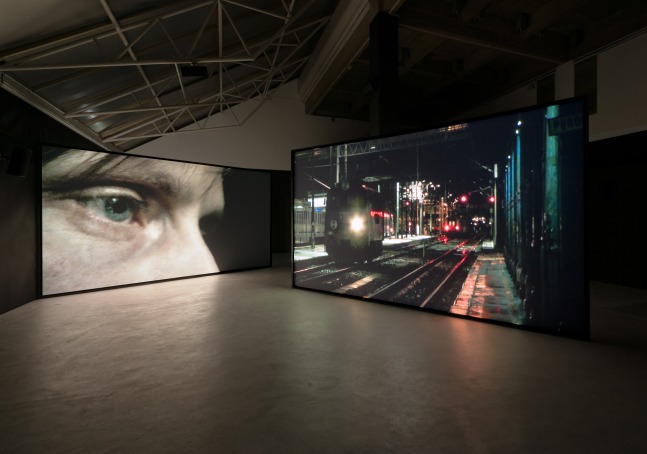 Installation view of photographs and sculptures by Douglas Gordon