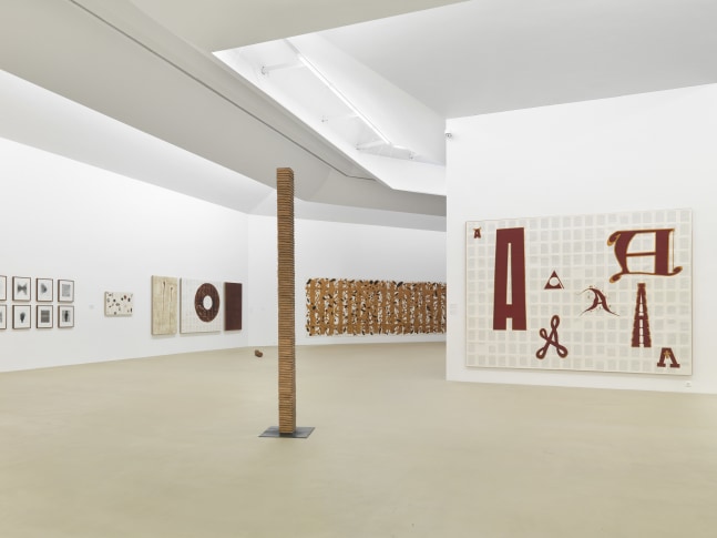 Installation view of paintings by Tim Rollins and K.O.S.