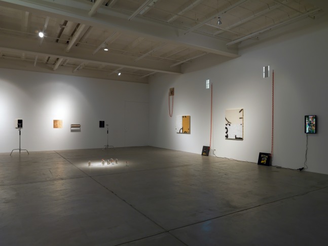 Installation view of Adam Pendleton and Pope.L wall-based works and sculptural installation