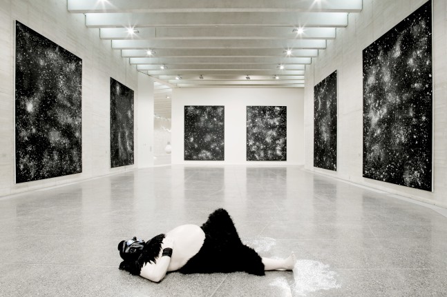 Installation view of sculpture and paintings by Ugo Rondinone