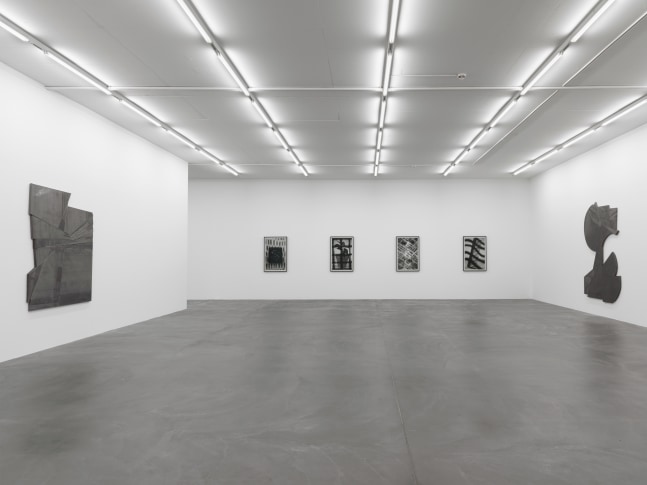 Installation view of Wyatt Kahn wall reliefs and photographs