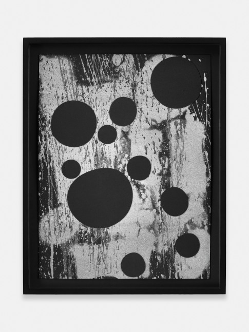 black and white collage of round shapes on paper