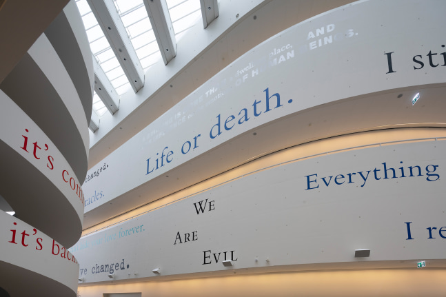 Installation view of wall quotes by Douglas Gordon