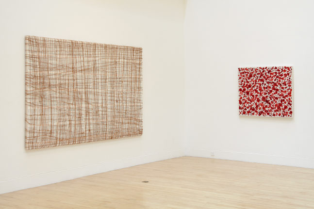 Installation view of works by Tim Rollins and K.O.S.