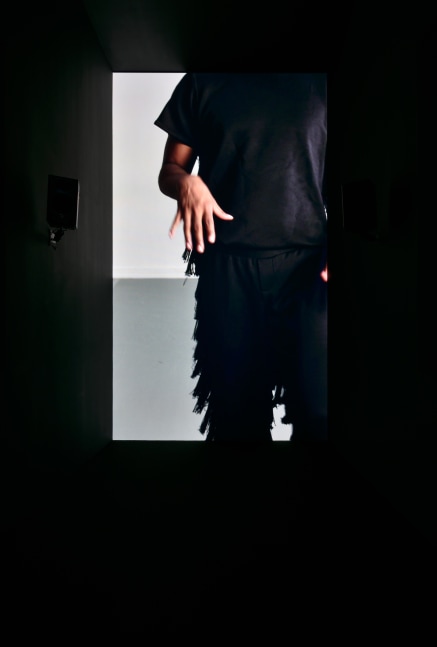 Installation view of video work by Adam Pendleton