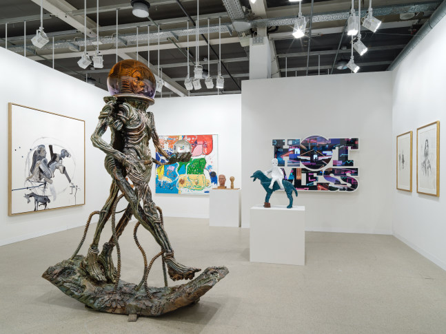 installation view of paintings and sculptures by various artists